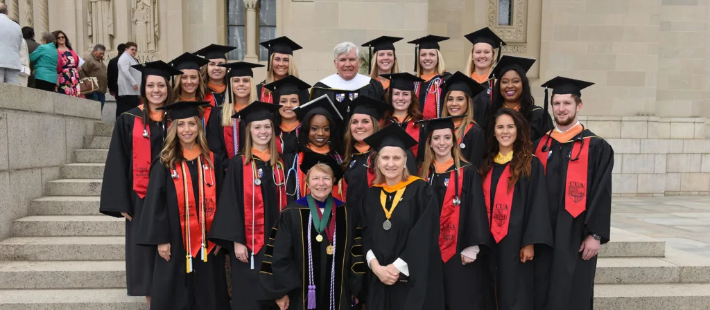 Students wearing custom graduation stoles in bulk at a school ceremony