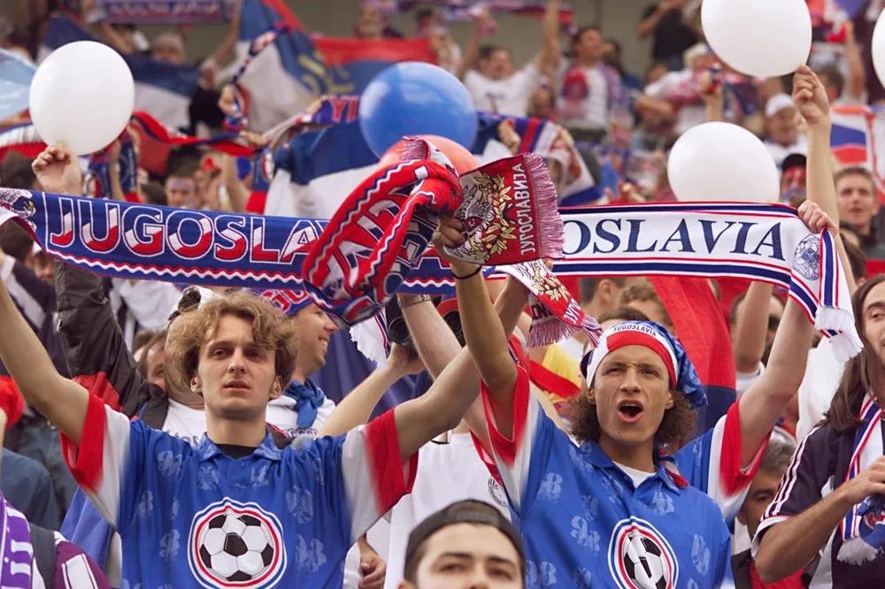 fans wearing custom football fan scarves cheering in stadium