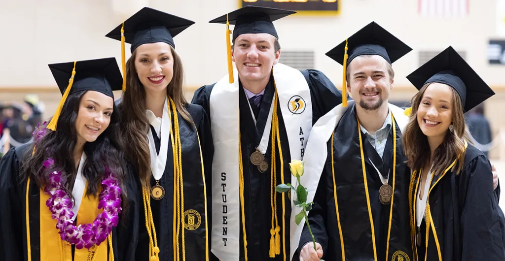 university students wearing custom graduation sashes