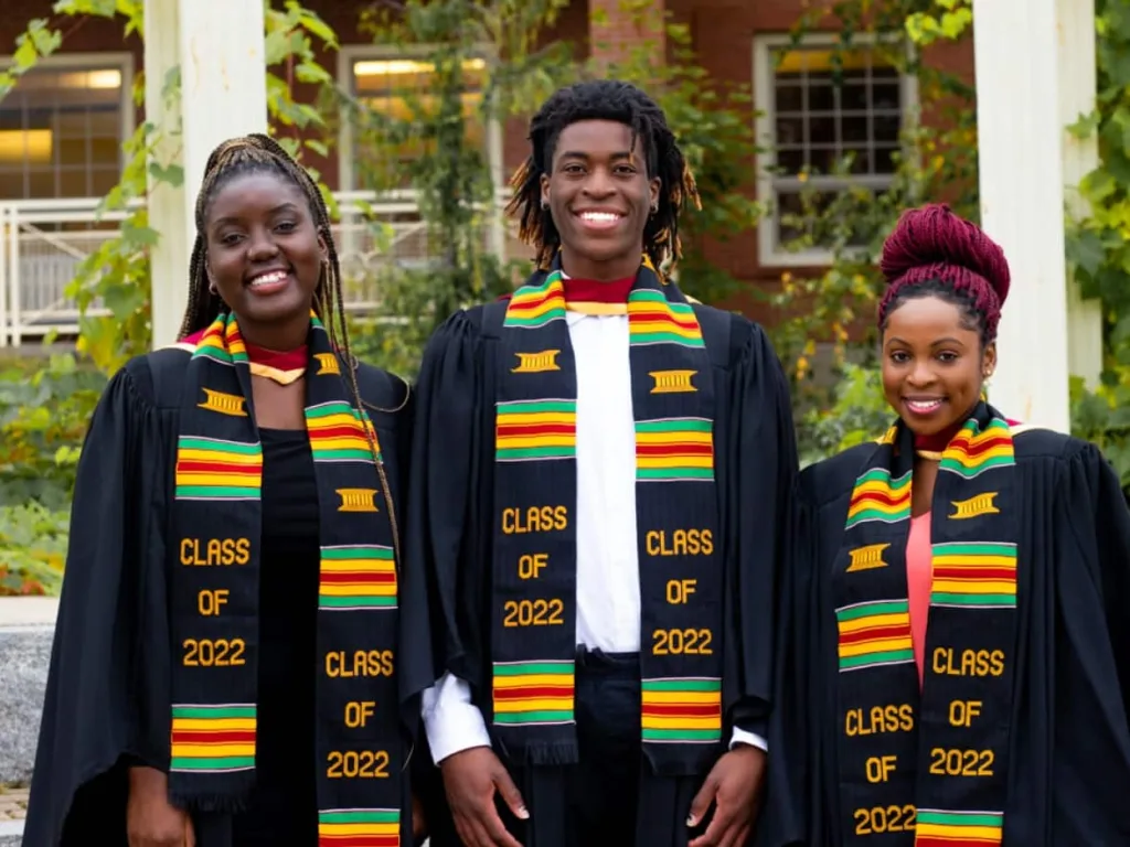 students wearing kente graduation stoles at commencement